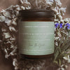 Coastal Cove Candle Co. candle with eucalyptus and French lavender scent on a floral background