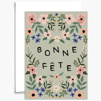 Greeting card with floral design and 'Bonne Fète' text on a light green background