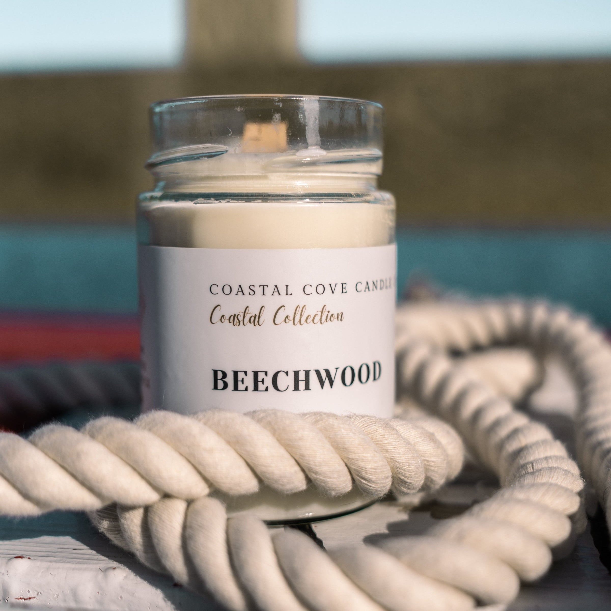 Image of a handcrafted soy wax candle with a wooden wick.