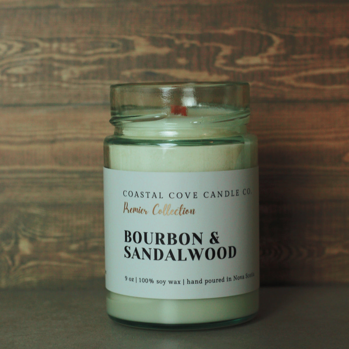 Image of a handcrafted soy wax candle with a wooden wick